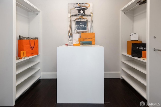 spacious closet featuring wood finished floors