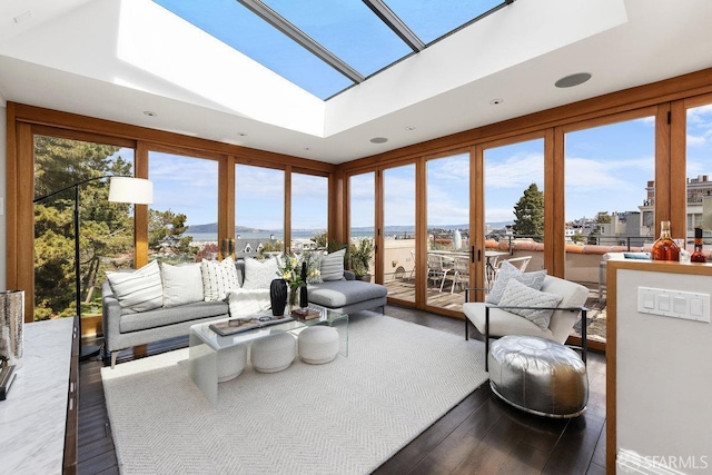 sunroom / solarium featuring a wealth of natural light and a skylight