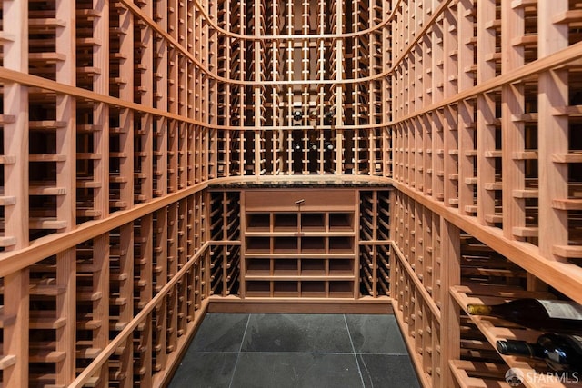 wine room with dark tile patterned floors