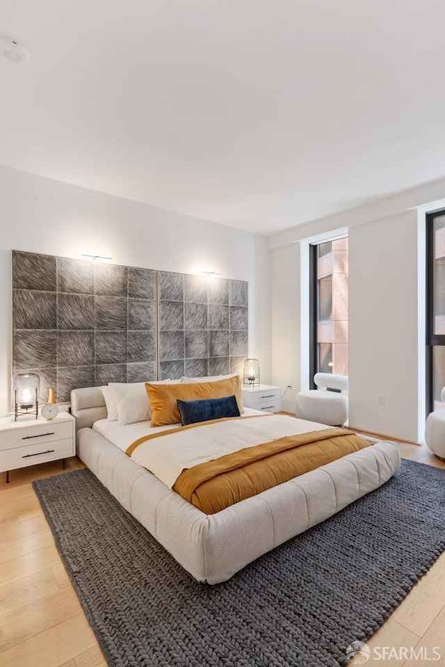 bedroom with wood finished floors