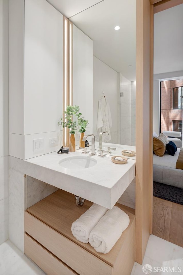 bathroom with vanity and recessed lighting