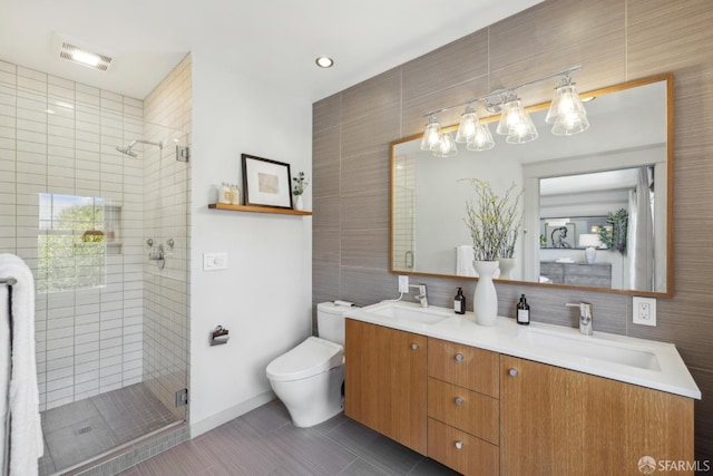 1383 8th Ave, San Francisco, CA 94122 - bathroom featuring tile walls, a stall shower, double vanity, toilet, and tile patterned flooring