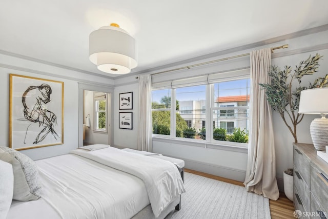 1383 8th Ave, San Francisco, CA 94122 - bedroom with wood finished floors and baseboards