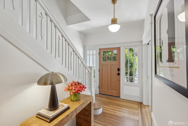 1383 8th Ave, San Francisco, CA 94122 - foyer entrance with light wood-style flooring and stairway