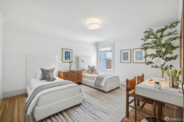 1383 8th Ave, San Francisco, CA 94122 - bedroom with wood finished floors, ornamental molding, and baseboards