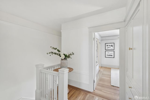 1383 8th Ave, San Francisco, CA 94122 - hallway featuring light wood-type flooring, an upstairs landing, and baseboards
