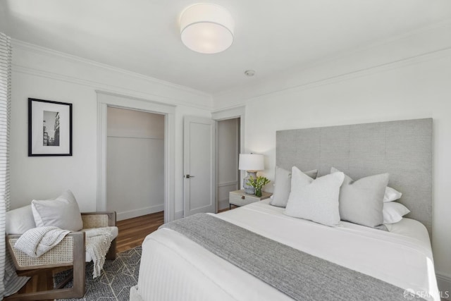 1383 8th Ave, San Francisco, CA 94122 - bedroom featuring dark wood finished floors, a closet, and crown molding