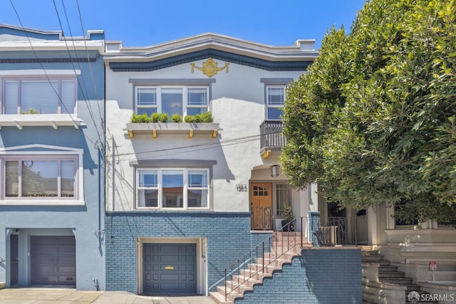 1383 8th Ave, San Francisco, CA 94122 - view of front of home with a garage and stucco siding