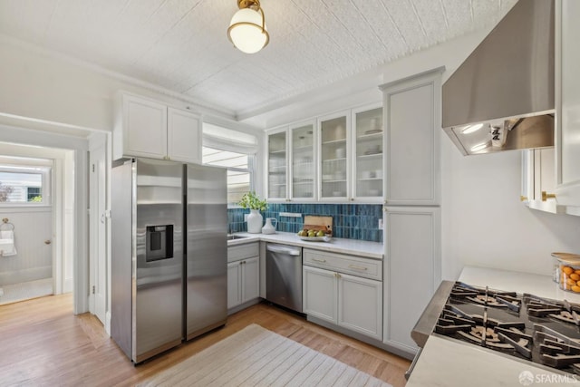 1383 8th Ave, San Francisco, CA 94122 - kitchen featuring stainless steel appliances, exhaust hood, gray cabinets, and healthy amount of natural light