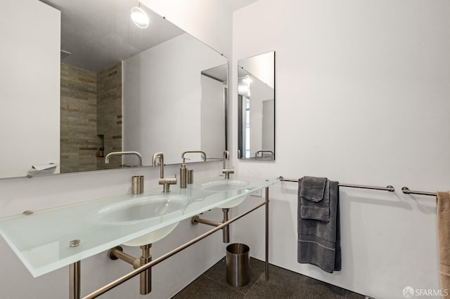 full bath featuring granite finish floor and a sink