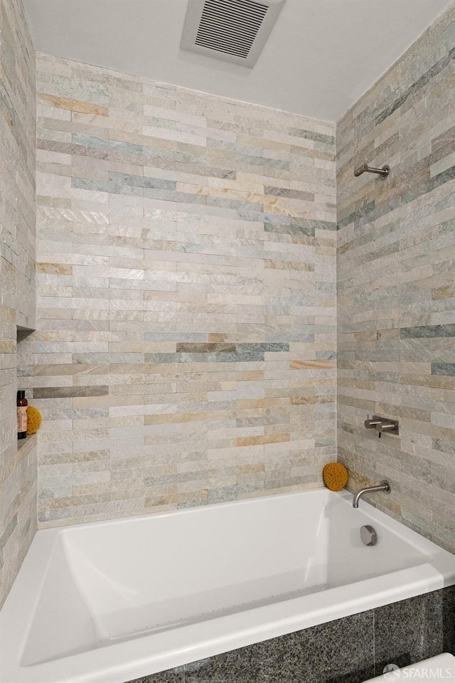 full bathroom featuring shower / bathtub combination and visible vents