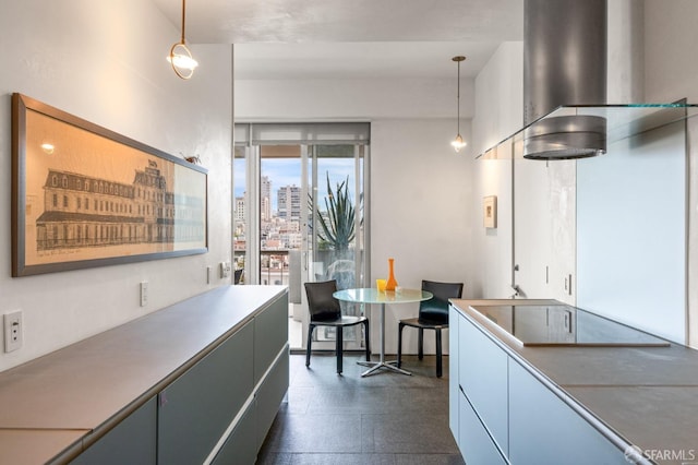 kitchen featuring decorative light fixtures and a city view