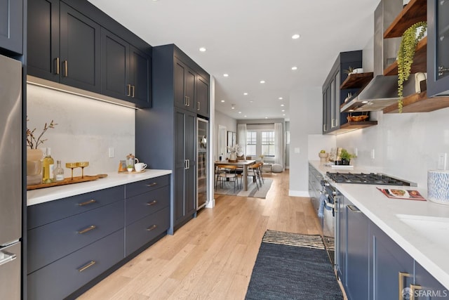 807 Vienna St, San Francisco, CA 94112 - kitchen featuring light wood-style floors, stainless steel appliances, light countertops, recessed lighting, and open shelves