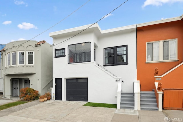 807 Vienna St, San Francisco, CA 94112 - view of front of house with stucco siding, a garage, and concrete driveway