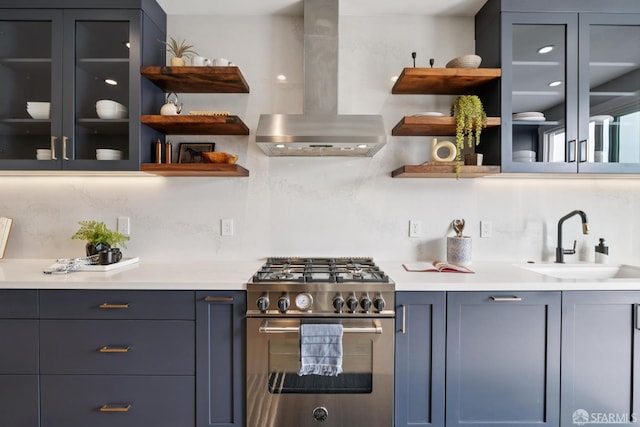 807 Vienna St, San Francisco, CA 94112 - kitchen with island exhaust hood, high end stainless steel range, open shelves, light countertops, and backsplash