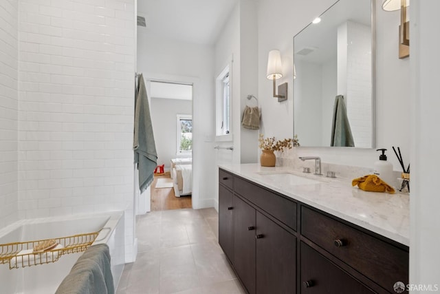 807 Vienna St, San Francisco, CA 94112 - bathroom with vanity, tiled tub, tile patterned flooring, and connected bathroom