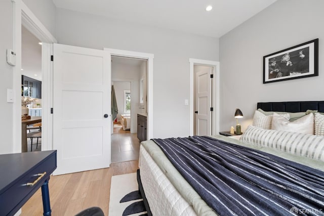 807 Vienna St, San Francisco, CA 94112 - bedroom with light wood finished floors, recessed lighting, and connected bathroom