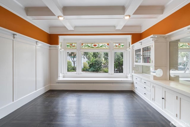 interior space featuring coffered ceiling, beamed ceiling, and a healthy amount of sunlight