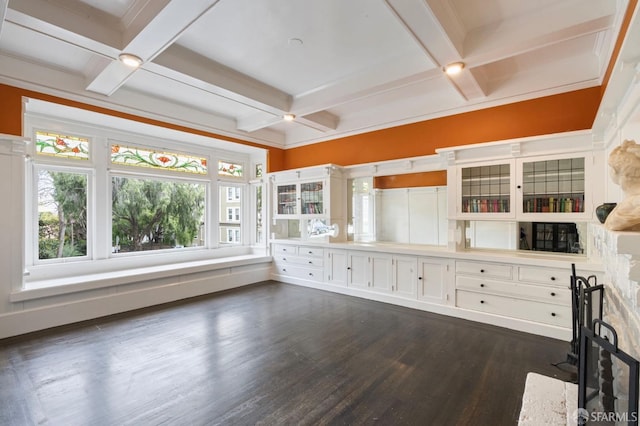 interior space with white cabinetry, dark hardwood / wood-style floors, coffered ceiling, and beamed ceiling