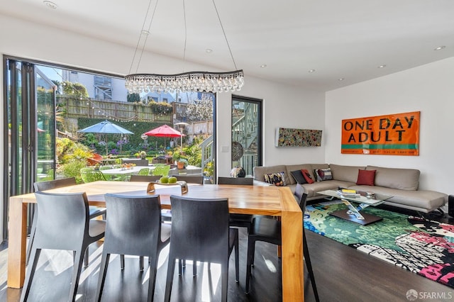 dining space with hardwood / wood-style floors