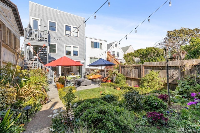 back of property featuring outdoor lounge area and a patio