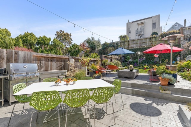 view of patio with a grill and exterior kitchen