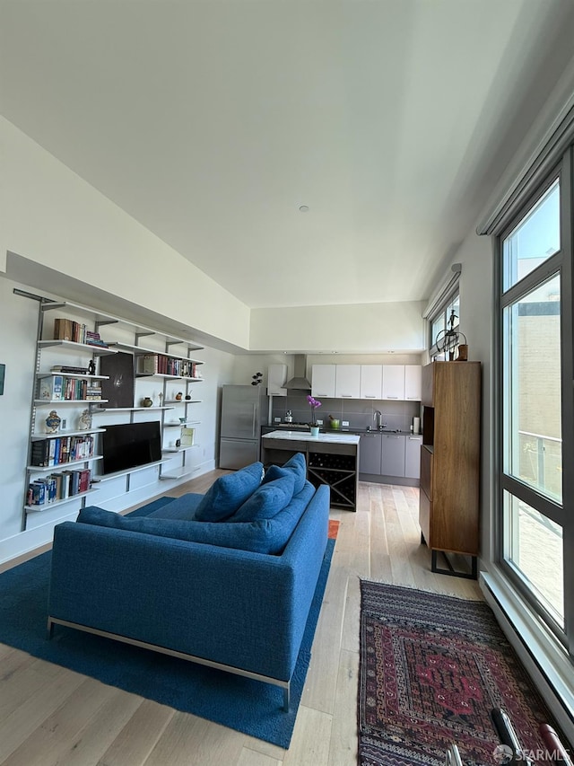 1075 Market St Unit 810, San Francisco, CA 94103 - living area featuring a baseboard radiator and light wood finished floors