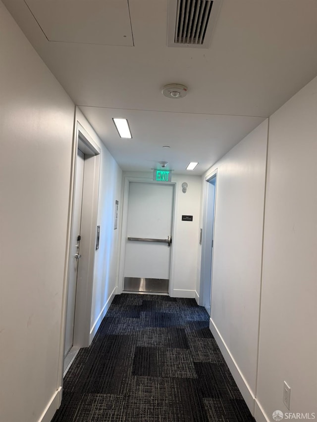 1075 Market St Unit 810, San Francisco, CA 94103 - hallway with baseboards and dark carpet