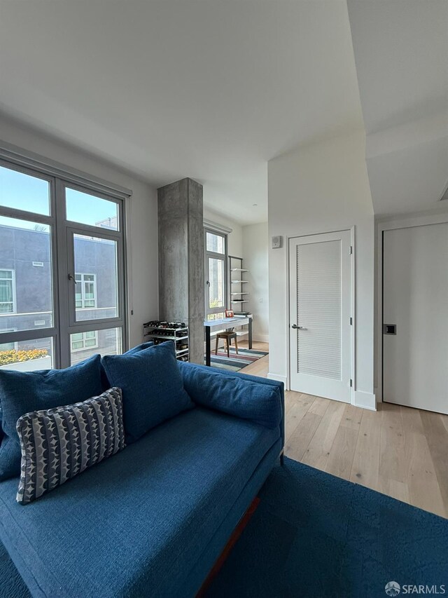 1075 Market St Unit 810, San Francisco, CA 94103 - living room with hardwood / wood-style flooring and healthy amount of natural light