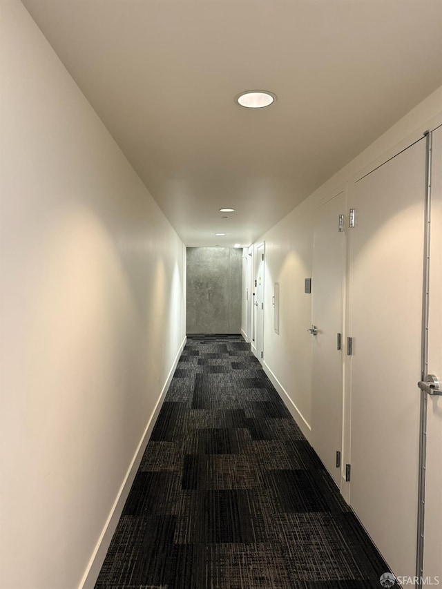 1075 Market St Unit 810, San Francisco, CA 94103 - corridor featuring dark carpet, baseboards, and recessed lighting