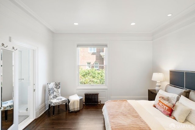 bedroom featuring dark wood finished floors, baseboards, recessed lighting, radiator heating unit, and ornamental molding