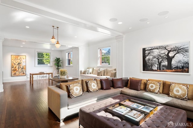 living room with recessed lighting, wood finished floors, ornamental molding, and decorative columns