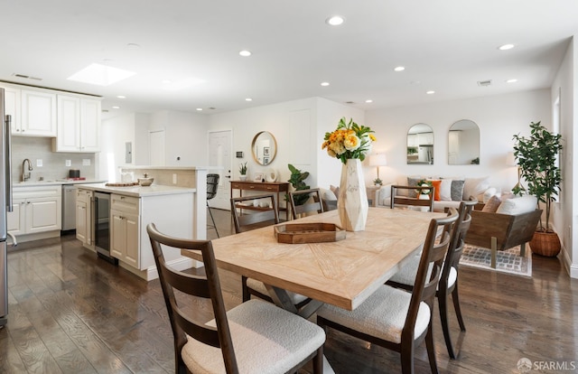 104 Bache St Unit A, San Francisco, CA 94110 - dining space featuring wine cooler, dark wood-style floors, a skylight, and recessed lighting