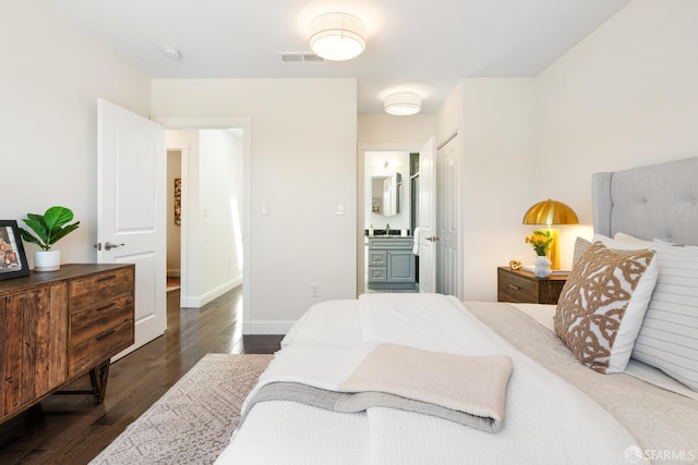 104 Bache St Unit A, San Francisco, CA 94110 - bedroom with wood finished floors, connected bathroom, and baseboards