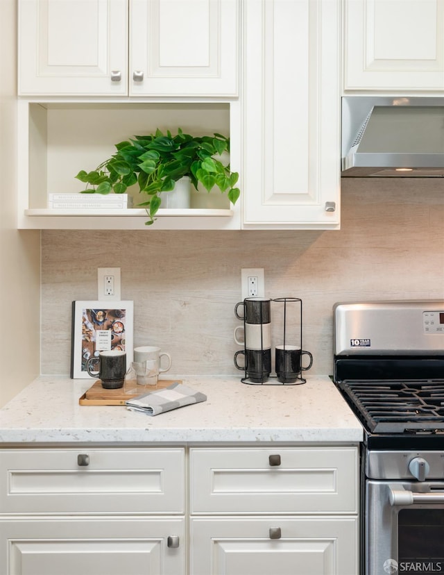 104 Bache St Unit A, San Francisco, CA 94110 - kitchen with stainless steel gas stove, under cabinet range hood, decorative backsplash, white cabinets, and open shelves