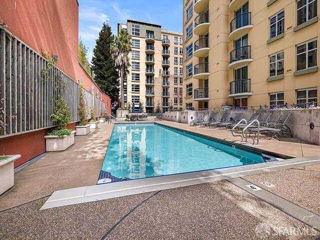 1701 Jackson St Unit 105, San Francisco, CA 94109 - community pool featuring a patio area and fence