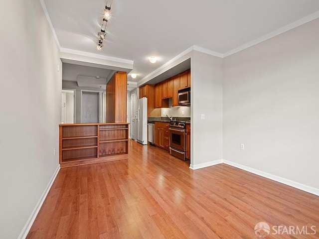 1701 Jackson St Unit 105, San Francisco, CA 94109 - kitchen featuring light wood-style flooring, brown cabinetry, ornamental molding, appliances with stainless steel finishes, and baseboards