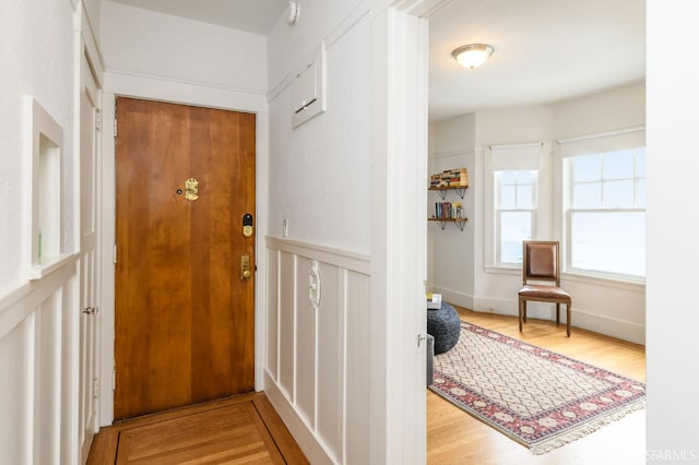 entryway with hardwood / wood-style flooring