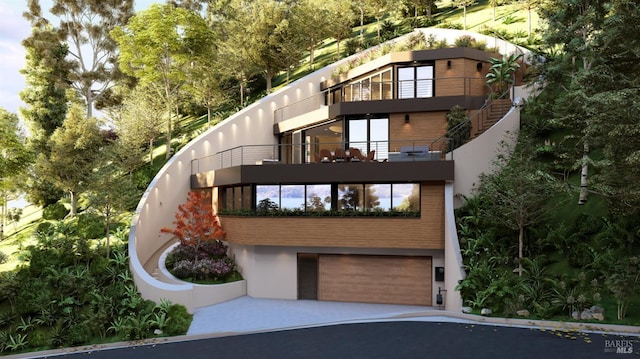 77 Crescent Ave, Sausalito, CA 94965 - view of front of home featuring a garage, a balcony, stucco siding, and driveway