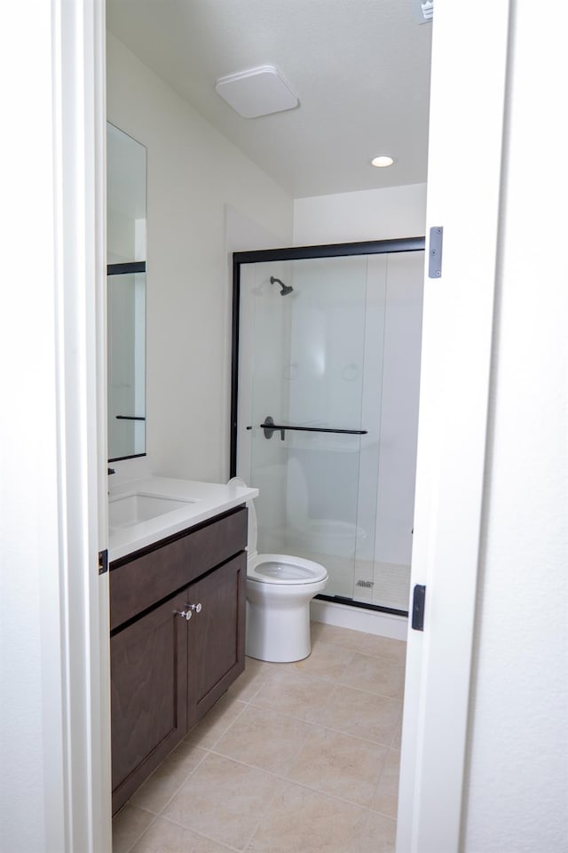 full bathroom featuring a shower stall, vanity, tile patterned floors, toilet, and recessed lighting