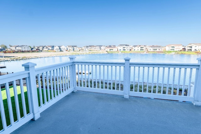 balcony with a water view and a residential view