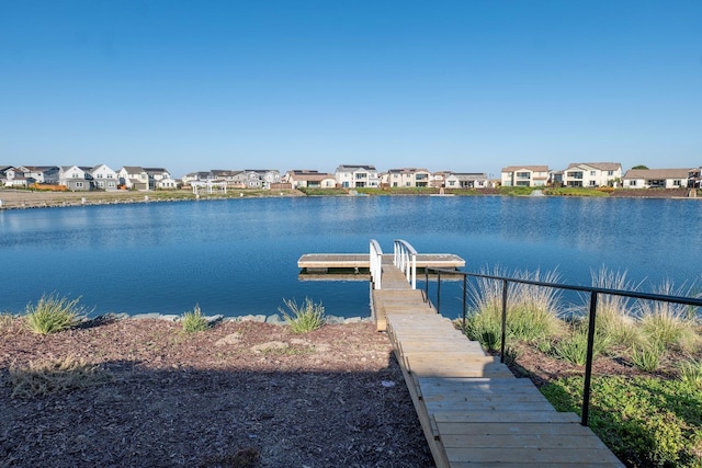 dock area with a water view and a residential view