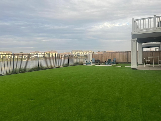 view of yard featuring a fire pit and a patio