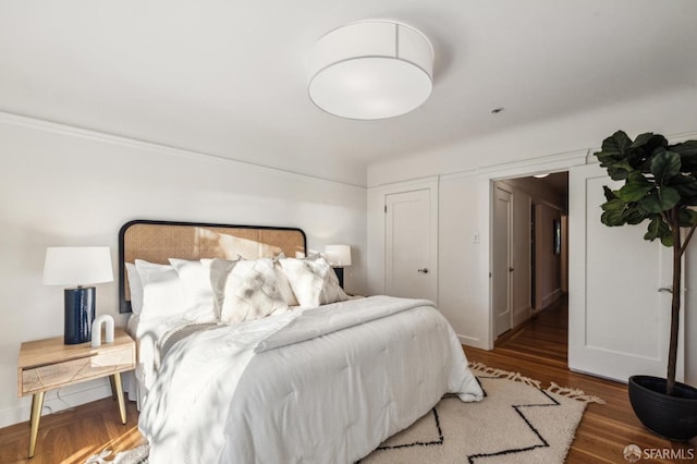 bedroom featuring dark wood-type flooring