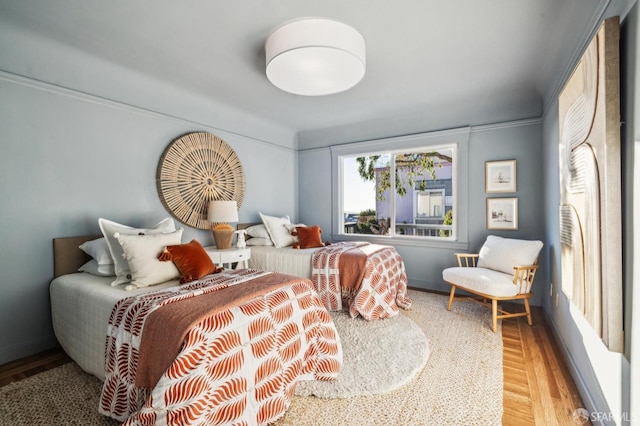 bedroom with hardwood / wood-style floors