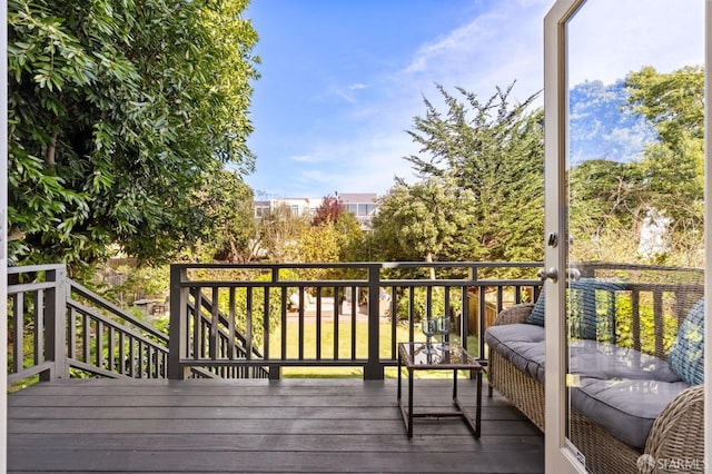 wooden deck with an outdoor hangout area