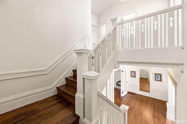 stairway with wood finished floors