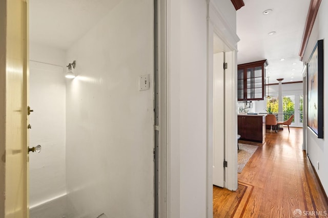 hallway with recessed lighting and wood finished floors