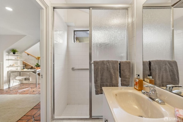 bathroom with recessed lighting, a shower stall, vanity, and tile patterned floors