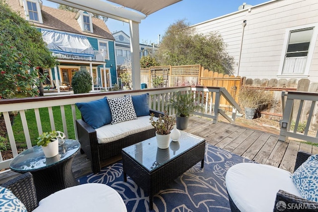 wooden terrace with an outdoor hangout area